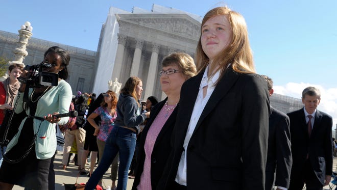 Abigail Fisher, who sued the University of Texas over the use of racial preferences, outside the Supreme Court on Oct. 10, 2012, after her first case was heard. She may be back next year.