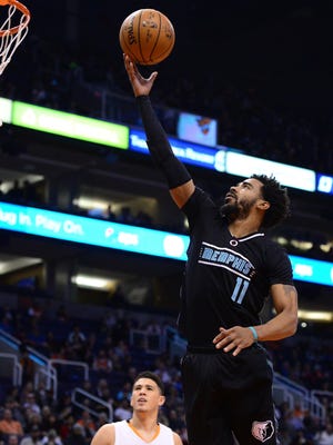 Jan 30, 2017: Memphis Grizzlies guard Mike Conley (11) drives to the basket against the Phoenix Suns in the first half of the NBA game at Talking Stick Resort Arena.