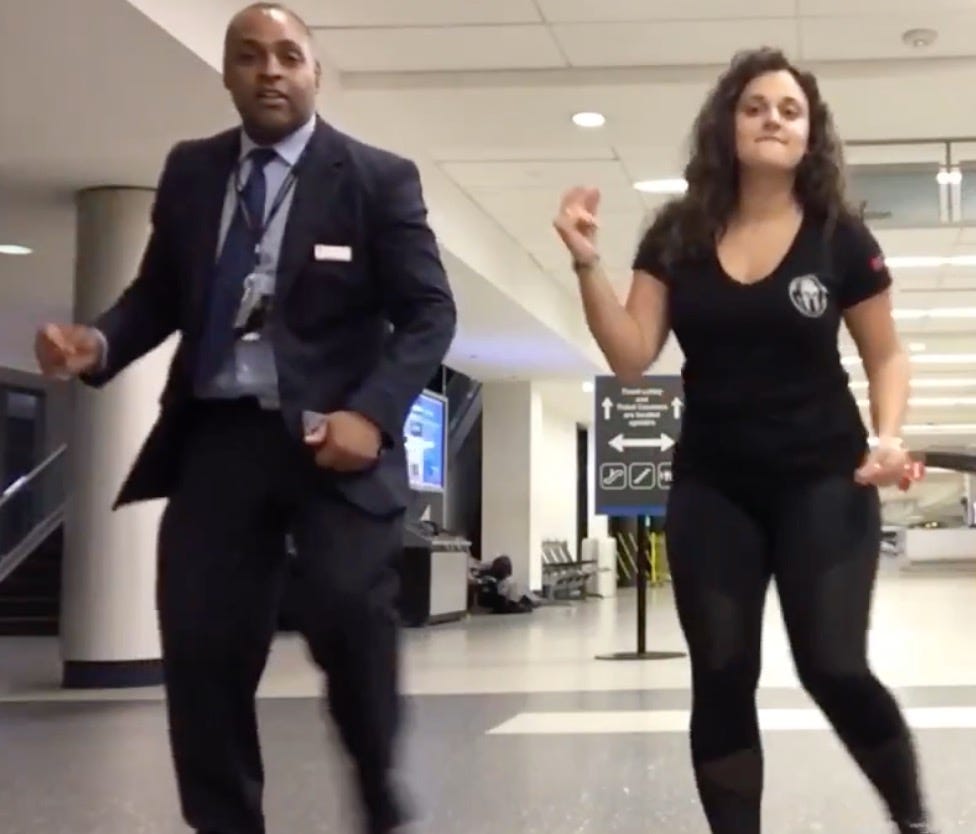 Mahshid Mazooji dances all night long in an airport in a still from a YouTube video.