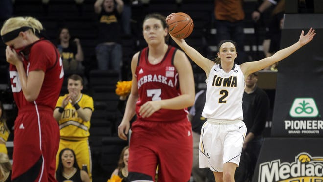 Iowa's Ally Disterhoft pumps up the crowd in the final minutes of overtime against Nebraska at Carver-Hawkeye Arena on Monday. Disterhoft finished the game with 20 points and 13 rebounds as the Hawkeyes snapped an eight-game losing streak to the Cornhuskers.