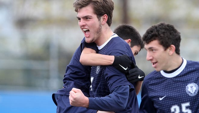 Pingry's Jamie Smith celebrates a first half goal against Hawthorne Christian Academy in the Non-Public B state final, Sunday, November 16, 2014, at Kean University in Union, NJ. Jason Towlen/Staff Photographer