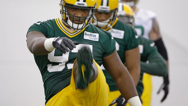 Green Bay Packers first-round draft pick Kenny Clark (97) drills during rookie camp practice in the Hutson Center.