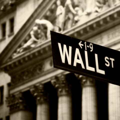 Wall Street sign in front of New York Stock Exchan