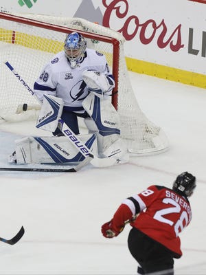Tampa Bay goaltender Andrei Vasilevskiy makes a second period save on Damon Severson of the Devils during Game 4 of the opening round of the Stanley Cup Playoffs on Wednesday, April 18, 2018 at Prudential Center in Newark.