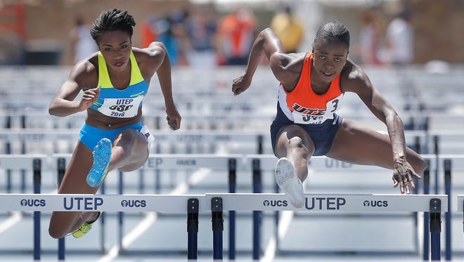 UTEP’s Tobi Amusan, right, outruns Bridgette Owens to win the women’s 100-meter hurdles Saturday at the University of Texas at El Paso Spring Invitational at Kidd Field. Amusan’s time of 12.83 broke the school record, track record and is the fourth fastest time in the world this year. See more photos at elpasotimes.com.