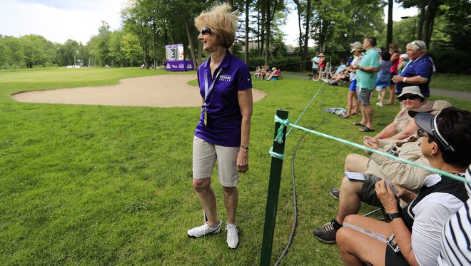 Volunteer Lois DePouw talks with spectators about inclement weather approaching on day 2 of the Thornberry Creek LPGA Classic on Friday in Hobart.