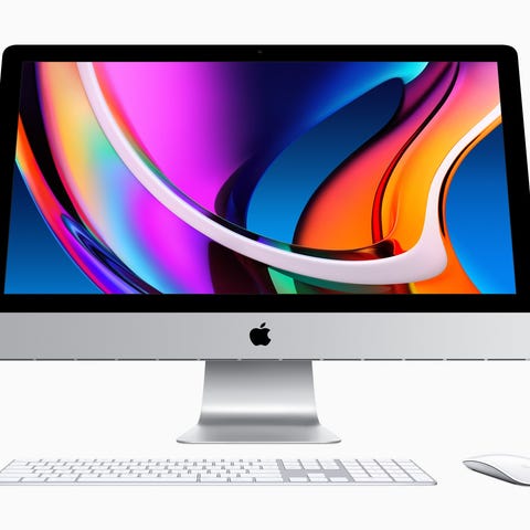 An Apple iMac displays a colorful screen.