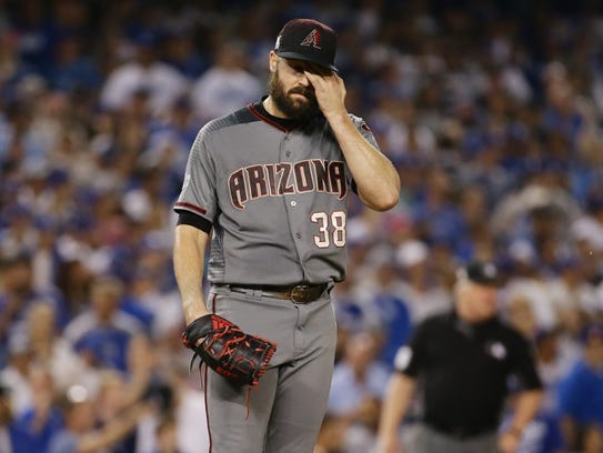 Robbie Ray reacts after allowing Dodgers base runner