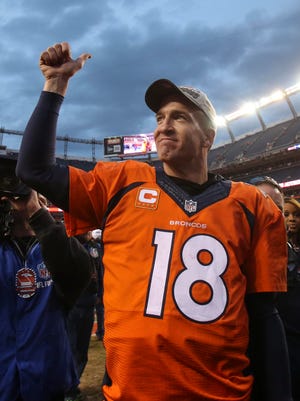 Denver Broncos quarterback Peyton Manning (18) gives a thumbs up to the fans after the AFC Championship football game at Sports Authority Field at Mile High. Denver Broncos defeated New England Patriots 20-18 to earn a trip to Super Bowl 50.