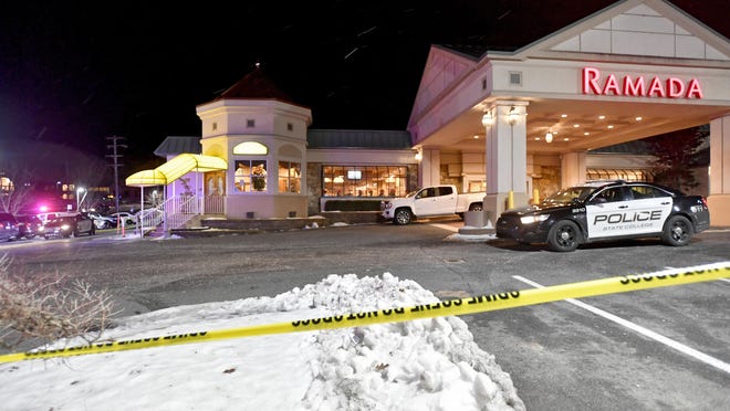 State College Police respond to a shooting at P.J. Harrigan's Bar & Grill at the Ramada Inn Thursday, Jan. 24, 2019, in State College, Pa. (Abby Drey/Centre Daily Times via AP)