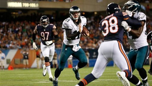 Eagles quarterback Carson Wentz runs with the ball during the 29-14 win over the Chicago Bears on Monday night.