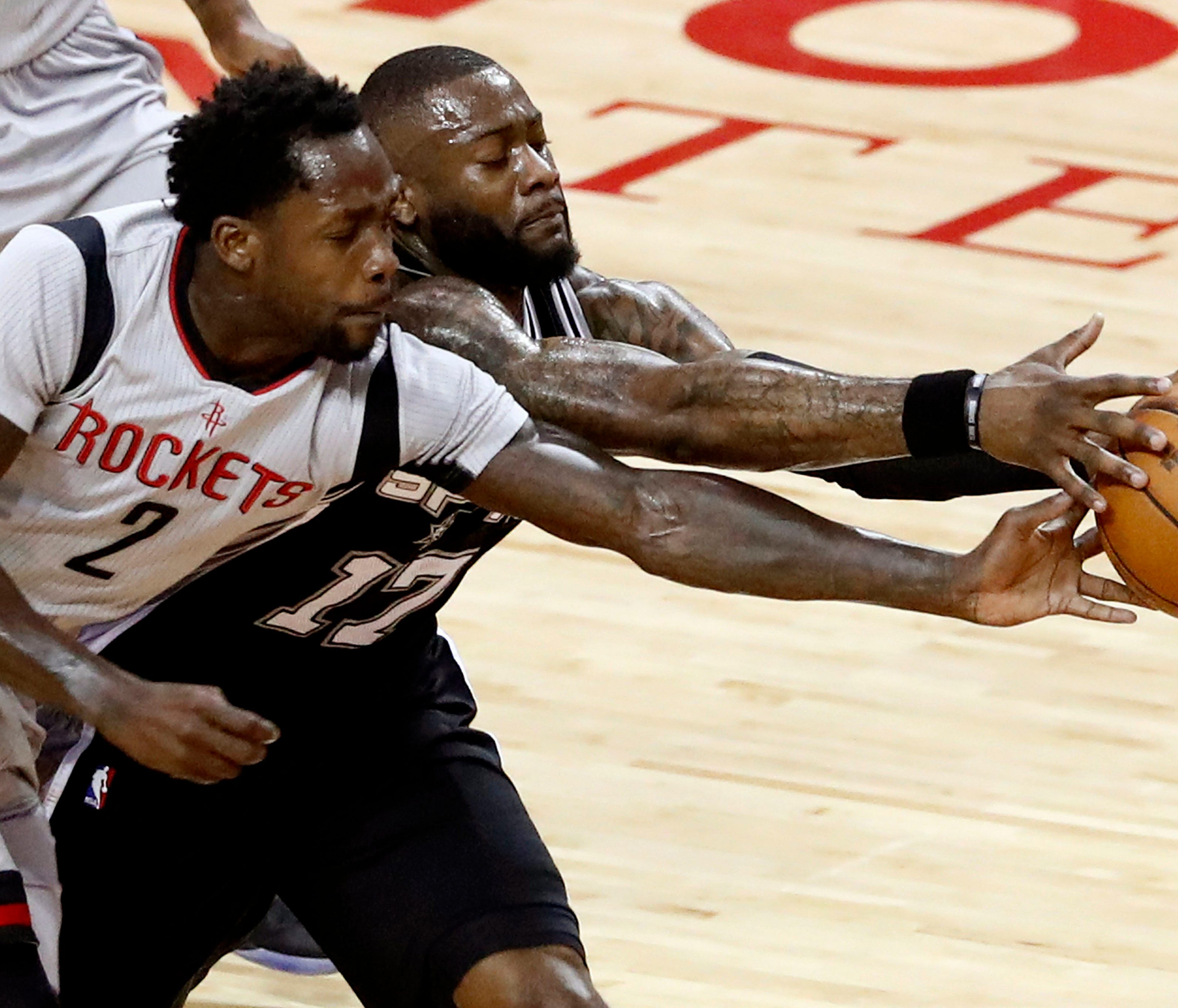 epa05958426 Houston Rockets guard Patrick Beverley (L) goes for a loose ball against San Antonio Spurs guard Jonathan Simmons (R) in the first half of the NBA basketball Western Conference semi-finals playoffs game six between the San Antonio Spurs a