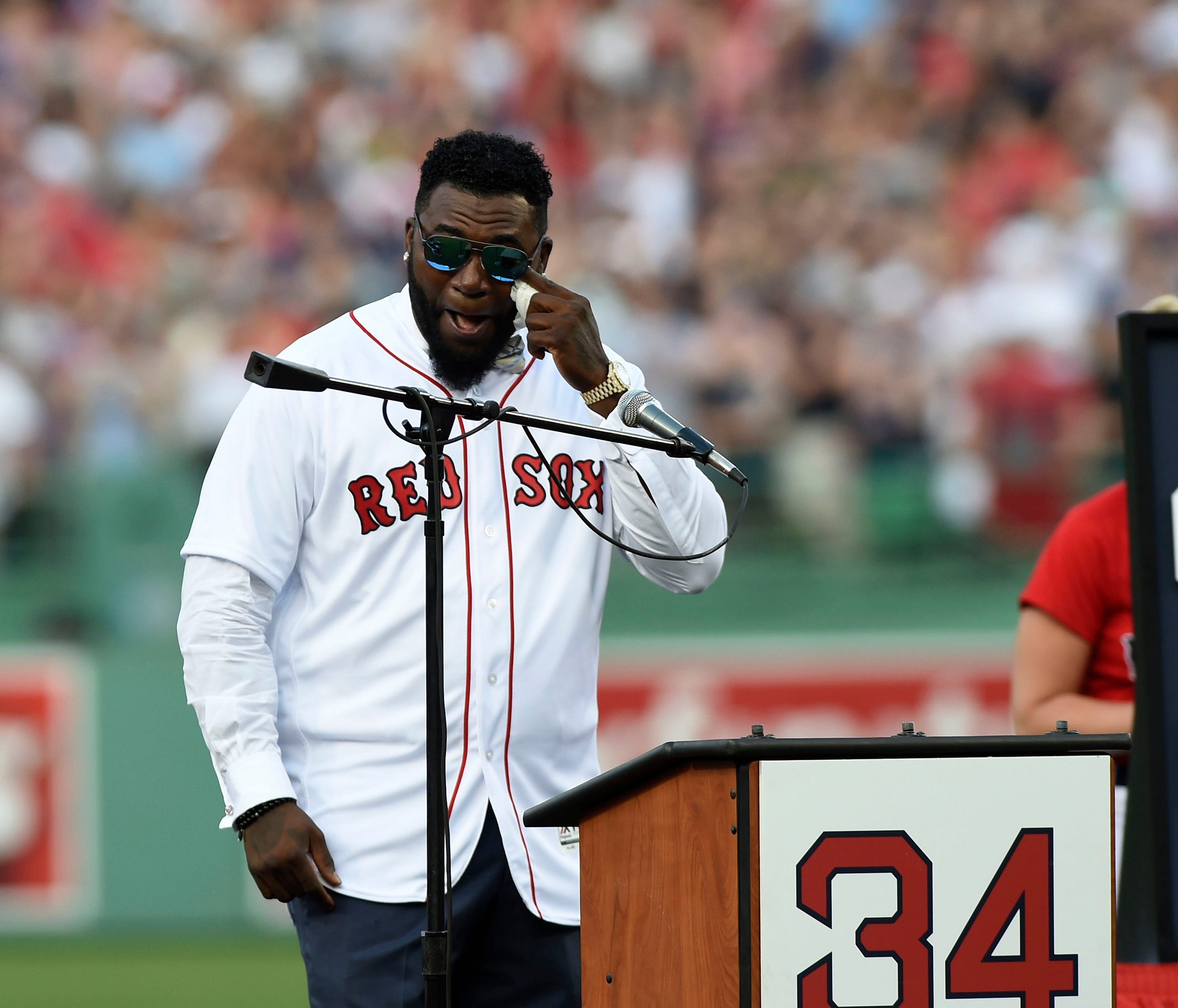 Jun 23, 2017; Boston, MA, USA; Boston Red Sox former designated hitter David Ortiz wipes tears during ceremonies in his honor before a game against the Los Angeles Angels at Fenway Park. Mandatory Credit: Bob DeChiara-USA TODAY Sports ORG XMIT: USATS