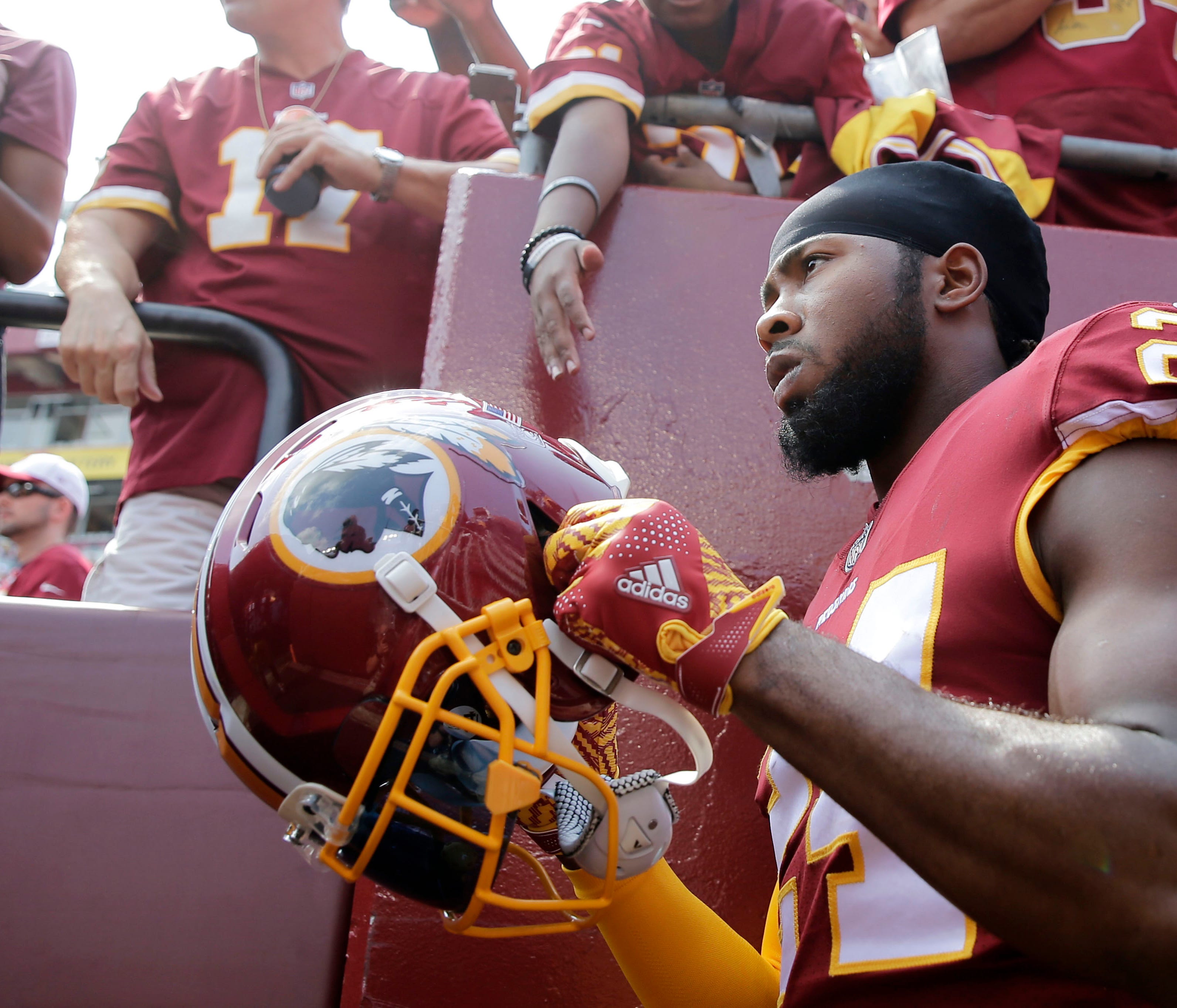 Washington Redskins cornerback Josh Norman walks onto the field prior to an NFL football game between the Philadelphia Eagles and Washington Redskins, Sunday, Sept. 10, 2017, in Landover, Md.