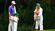 Webb Simpson watches his wife Dowd Simpson putt on