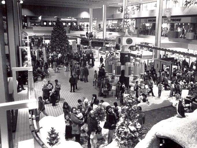 In this 1980 photo,
crowds flock to Midtown Plaza