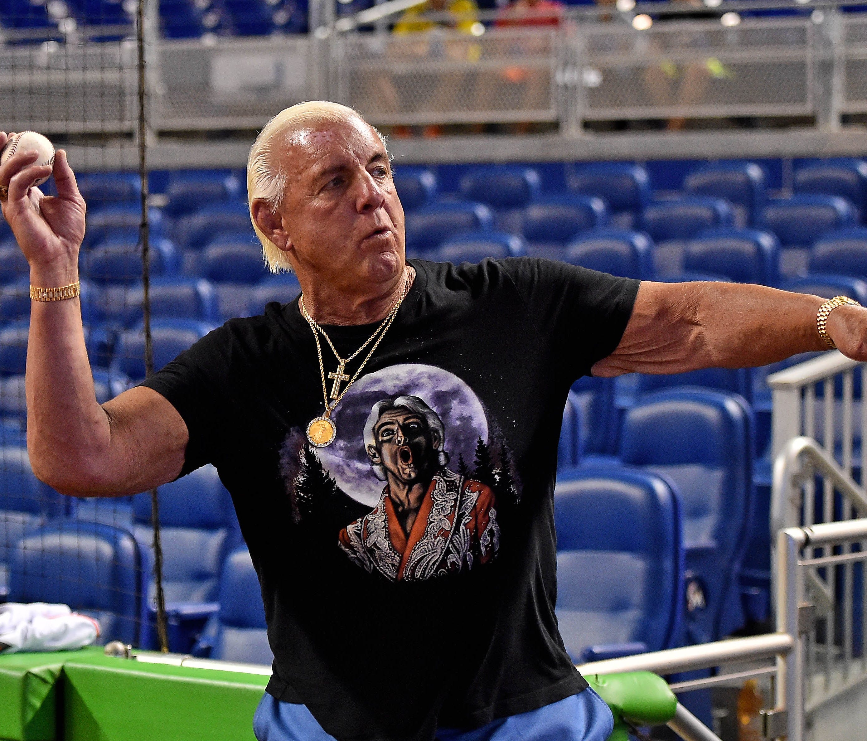 Ric Flair warms up before throwing out the first pitch at Marlins Park prior to the game between the Cincinnati Reds and the Miami Marlins game on July 28.