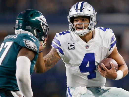 Dallas Cowboys quarterback Dak Prescott (4) runs the