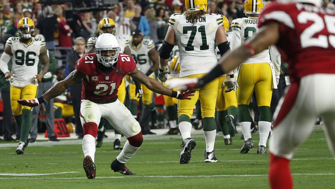 Arizona Cardinals CB Patrick Peterson (21) celebrates a touchdown by CB Jerraud Powers against Green Bay Packers during the third quarter in NFL action December 27, 2015 in Glendale, Ariz.