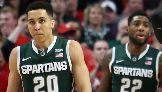 Michigan State players Travis Trice (20) and Branden Dawson play against the Wisconsin Badgers.