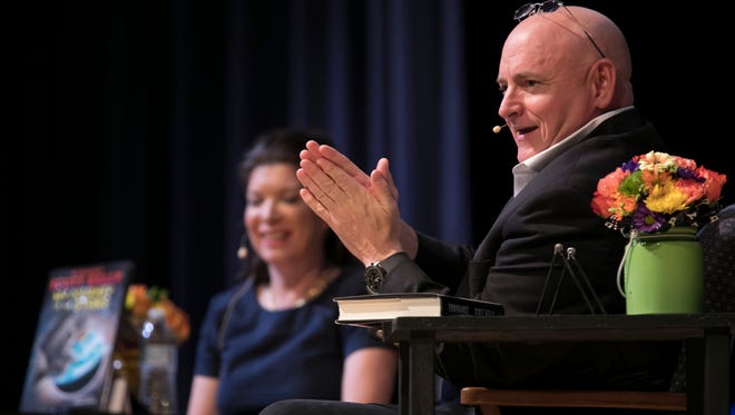 Astronaut Scott Kelly (right), who completed a 340-day mission aboard the International Space Station from 2015 to 2016, speaks with Kerryane Monahan, chair of the Saint Edward's School Science Department, during a talk about his new book "Endurance: A Year in Space, A Lifetime of Discovery" on Nov. 1, 2017, in Vero Beach. "At zero, those bolts are exploded open, the solid rocket motors are lit and it feels like the hand of God has just lifted you off that launchpad and is just throwing you out into outer space," Kelly said of the experience of lifting off.