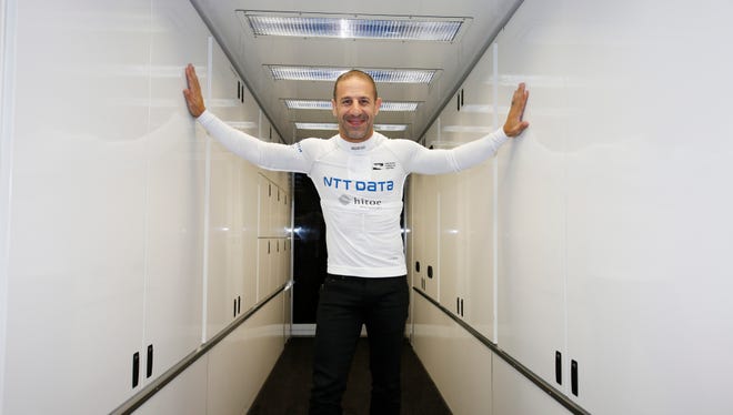IndyCar driver Tony Kanaan wears his new compression shirt that he wears under his uniform which has sensors that help his team monitor vitals before putting on his uniform in the Ganassi hauler at the Indianapolis Motor Speedway.