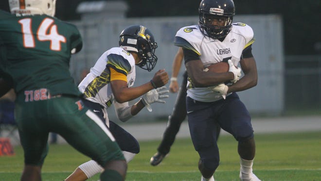 Lehigh running back Jalane Nelson carries the ball during the Lightning's 28-0 loss to Dunbar last week. Lehigh travels to South Fort Myers on Friday for The News-Press' Game of the Week.