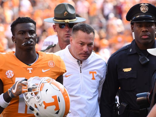 Butch Jones walks off the field after a Tennessee vs.