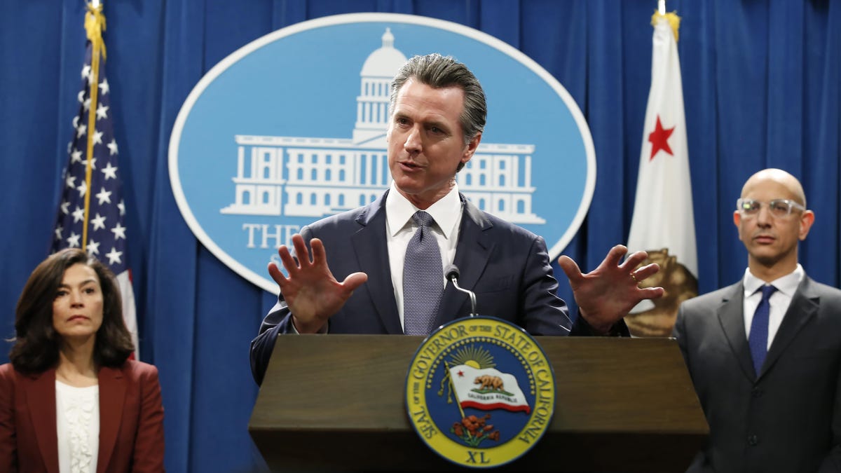 California Gov. Gavin Newsom speaks to reporters about the state's response to the coronavirus during a news conference in Sacramento, Calif. Newsom, a Democrat who leads the nation's most populous state, has won praise from both sides of the aisle for his approach to the crisis, though he's been less aggressive than some other governors and local leaders.