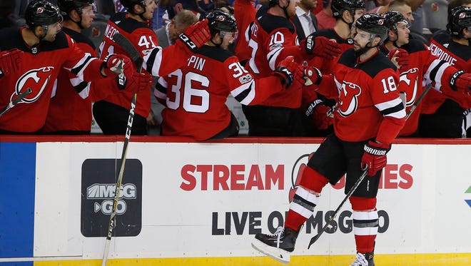New Jersey Devils right wing Drew Stafford (18) celebrates his goal against the New York Rangers during the third period of a preseason NHL hockey game in Newark, N.J., Saturday, Sept. 23, 2017. (AP Photo/Rich Schultz)