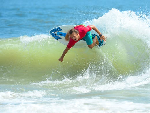 Lucas McCoy, Dewey Beach, catches a wave during the