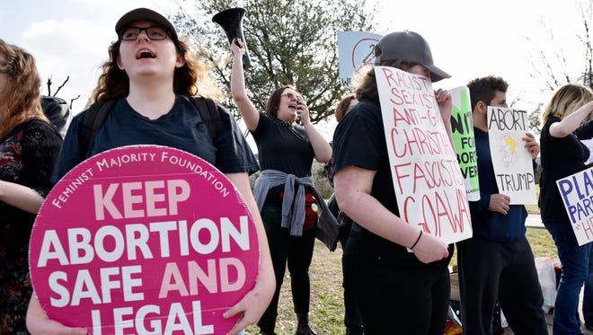 Abortion rights supporters chant slogans during a rally outside of the Planned Parenthood South Dallas Surgical Health Services Center on Feb. 11, 2017, in Dallas.