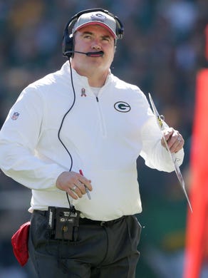 Green Bay Packers coach Mike McCarthy looks up to the scoreboard during their game against the St. Louis Rams.