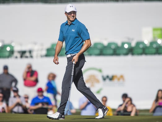 Jordan Spieth appears happy with his approach shot