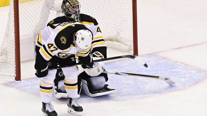 Bruins goaltender Jaroslav Halak (rear) and defenseman Torey Krug react after losing Game 5 of the Eastern Conference semifinals in double overtime to the Tampa Bay Lightning. The Bruins face a lot of decisions after getting eliminated in five games such as whether to retain Krug for next season.