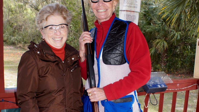 Andrea Mc Creanor keeps score for Myrt Rose at station one after she hit several clays.