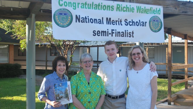 (From left) Grace Christian School's guidance counselor Marian Deville and Principal Kay Blackburn pose with Richie Wakefield and his mom Terry Wakefield.