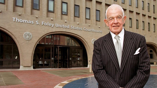 Tom Foley, pictured in 2001, stands outside the federal courthouse in Spokane, Wash., that bears his name.