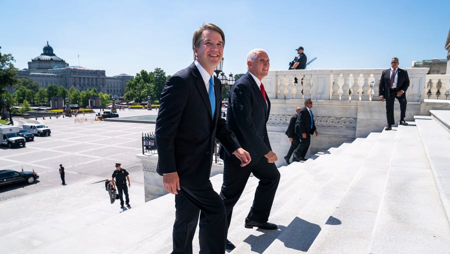 Supreme Court nominee Brett Kavanaugh walks up the