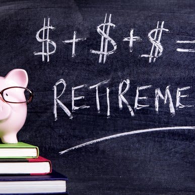 A piggy bank wearing glasses and atop a stack of books in front of a blackboard on which is written that dollar signs added together equal retirement