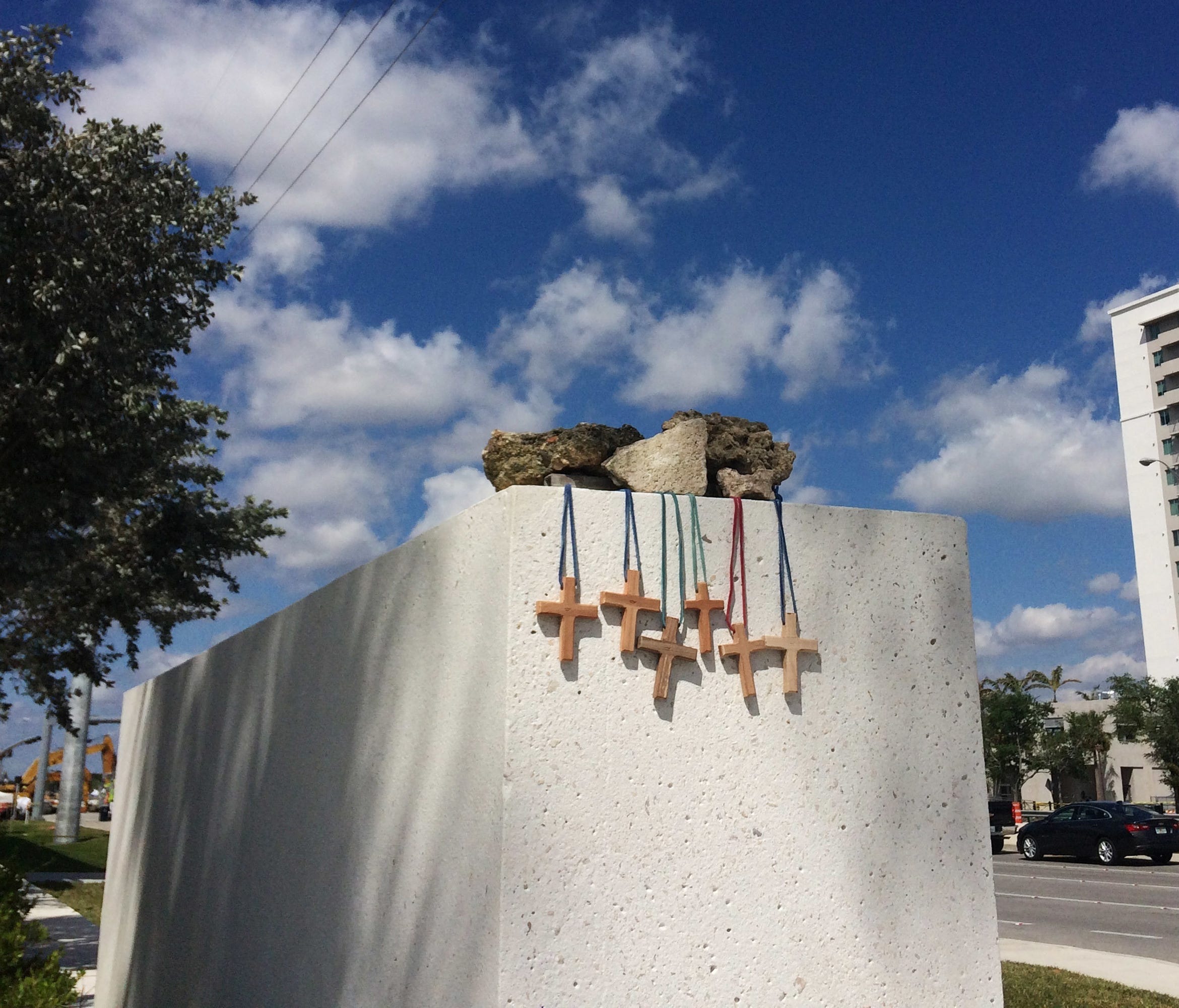 Six crosses are placed at a makeshift memorial on the Florida International University campus in Miami on March 17, 2018, near the scene of a pedestrian bridge collapse that killed at least six people on March 15.