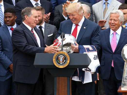 New England Patriots head coach Bill Belichick presents