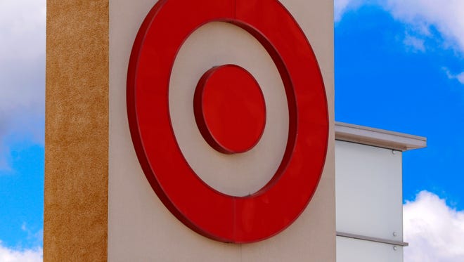 This May 3, 2017, photo shows the Target logo on a store in Upper Saint Clair, Pa. Target is jumping into voice-activated shopping as it deepens its relationship with Google, offering thousands of items found in the store except for perishables like fruit and milk. The move is happening as Google says shopping will be available later in 2017 through Google Assistant on iPhone and Android phones, joining its Google Home device and Android TV. (AP Photo/Gene J. Puskar)