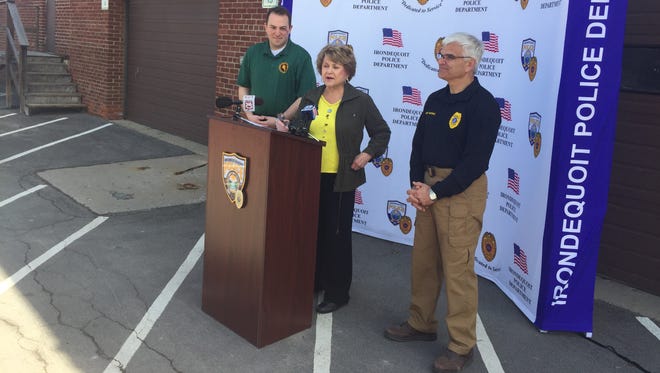 David Seeley, left, and Richard Tantalo join Rep. Louise Slaughter at a news conference Saturday, April 30, 2016, which was National Drug Take Back Day.