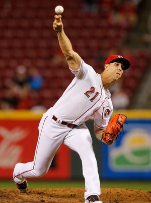 Cincinnati Reds relief pitcher Michael Lorenzen (21) delivers a pitch in the top of the eighth inning.