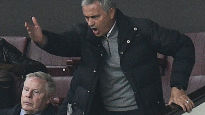 Manchester United manager Jose Mourinho gestures and shouts in the directors box after being sent off.