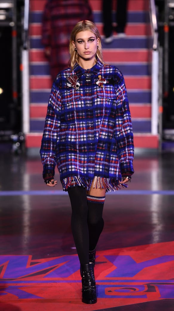 The oversized shirt dress was embellished with fringe.