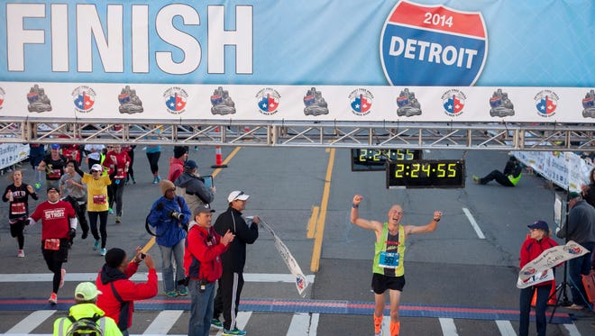 Mike Andersen of Walled Lake was the winner of the men's race in the Detroit Free Press/Talmer Bank Marathon on Sunday, Oct. 19, 2014.