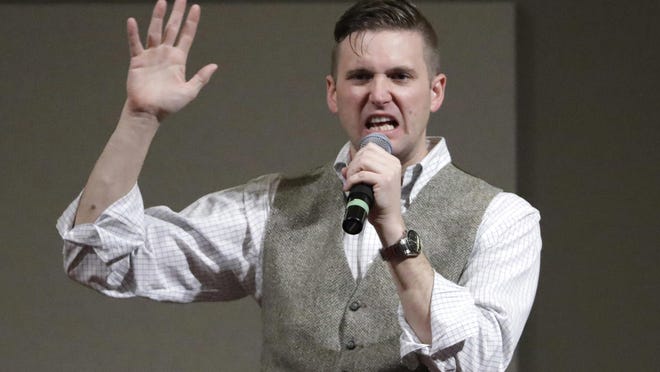 In this Dec. 6, 2016, file photo, Richard Spencer, who leads a movement that mixes racism, white nationalism and populism, speaks at the Texas A&M University campus in College Station, Texas.