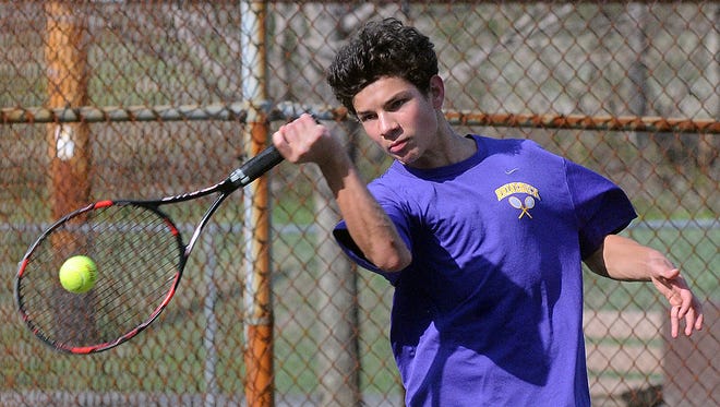 Rhinebeck High School’s Alec Gautier returns a shot at the net to Spackenkill High School’s Zayd Anwar during their second-singles match in Rhinebeck on Thursday. Gautier won the match.